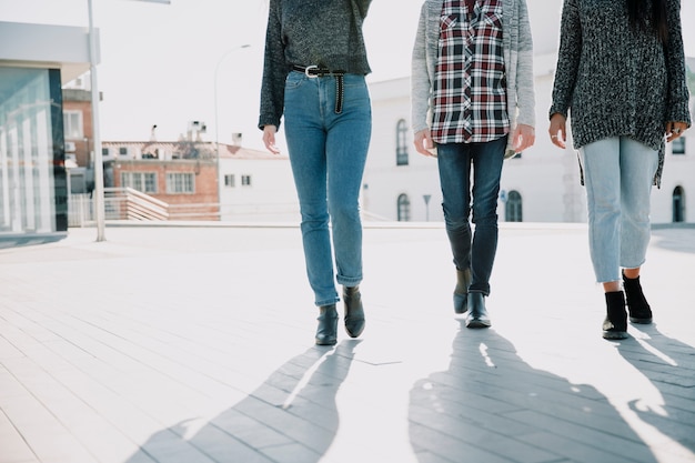 Free photo shadows of three persons walking