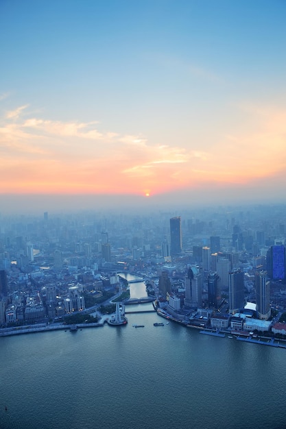 Free photo shanghai aerial view with urban architecture and sunset