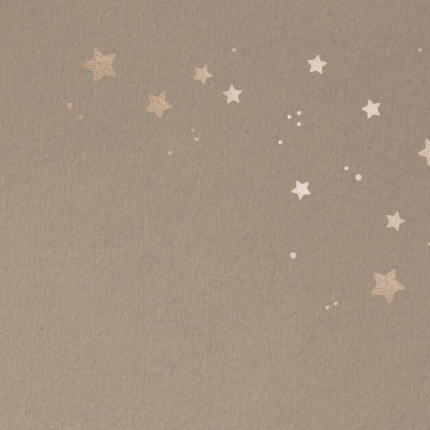 Shimmering gold stars on a beige background