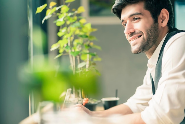 Free photo smart portrait caucasian businessman casual suit with beard smile with cheerful and confident in cafe next to window