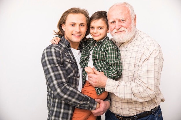 Free Photo smiling multi-generational family looking at camera