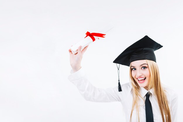 Smiling young graduating woman with diploma