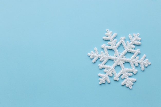 Free photo snowflake on blue surface