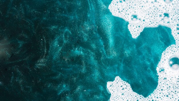 Soap foam on azure water