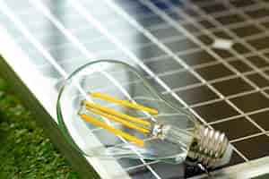 Free photo solar energy panel and light bulb green energy