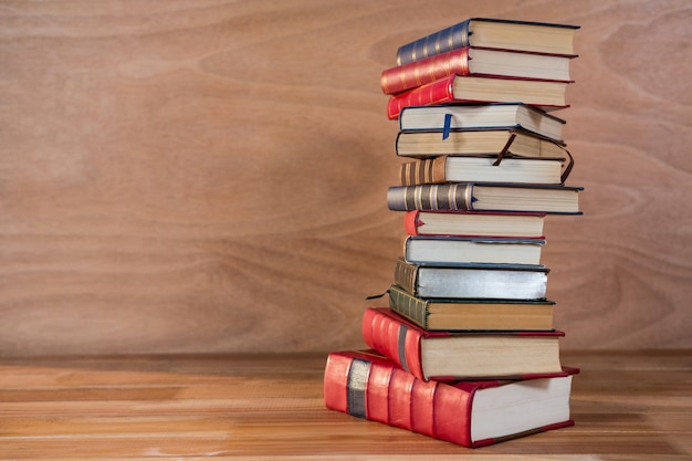 Stack of various books on a table