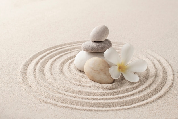 Free Photo stacked zen stones sand background art of balance concept