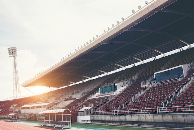 Free Photo stadium background with a green grass pitch in the daytime