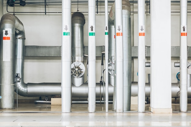 Free Photo steel pipelines and cables in a plant