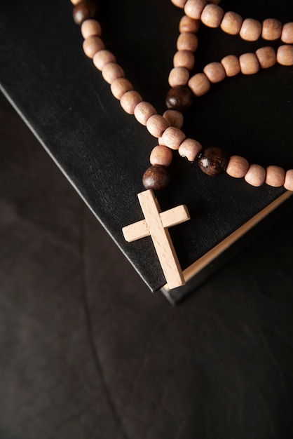 Free photo still life of crucifix with book