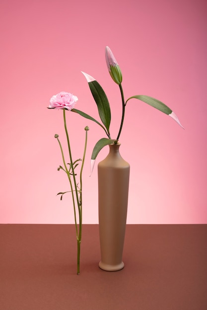 Free photo still life with colorful leaves and flowers