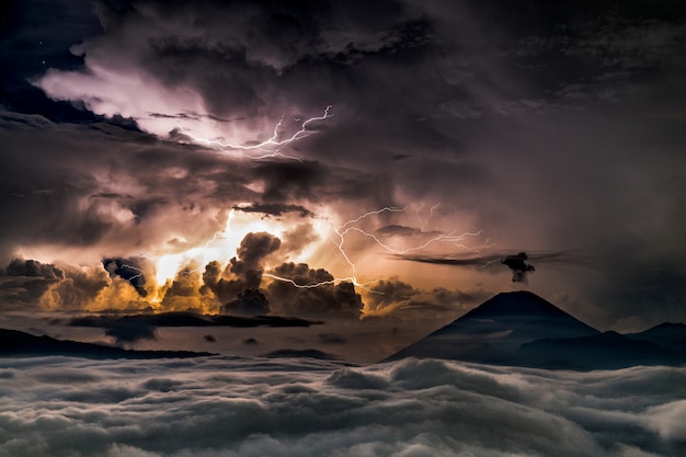 Free Photo storm in the sea with sun appearing behind the clouds