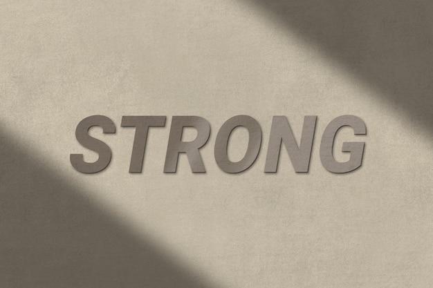 Free photo strong text in brown concrete textured font