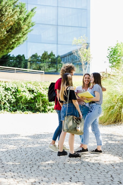 Free photo students talking outside campus