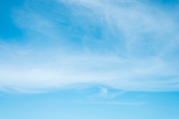 Free photo sunshine clouds sky during morning background. blue,white pastel heaven,soft focus lens flare sunlight. abstract blurred cyan gradient of peaceful nature. open view out windows beautiful summer spring