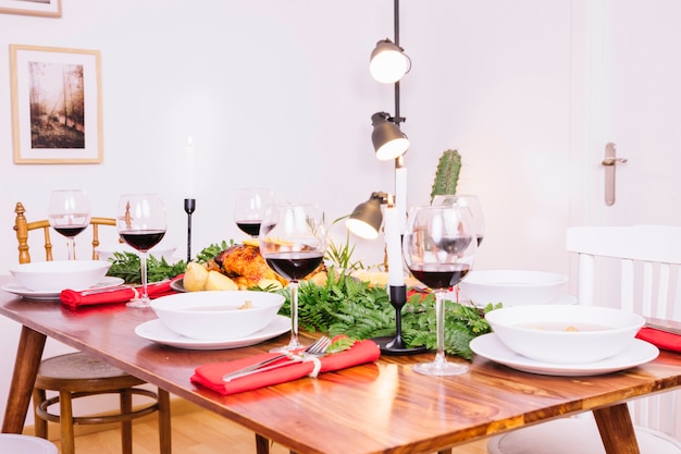 Free photo table with dishes and red wine