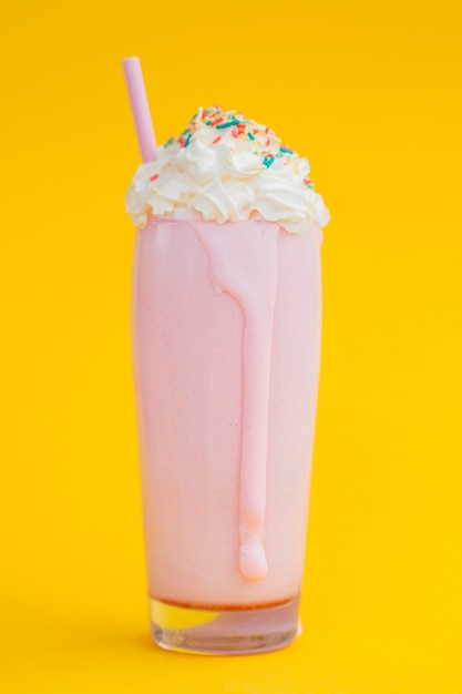 Free Photo tasty milkshake on yellow background