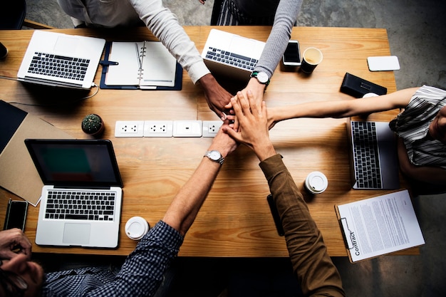 Free Photo team of business people stacking hands