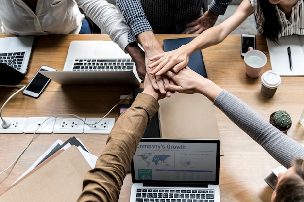 Free Photo team of business people stacking hands