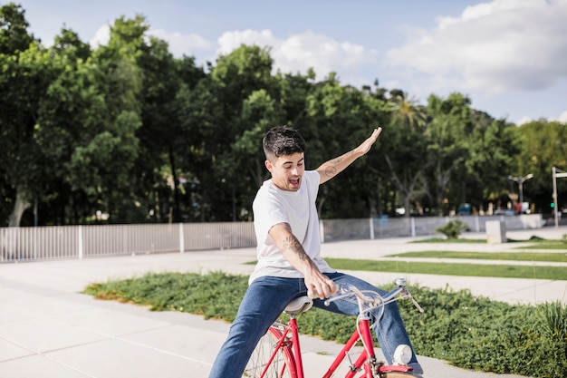 Teenage boy performing tricks on bicycle