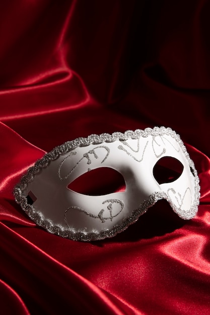 Theater mask on red curtain