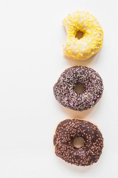 Three different donuts on white background