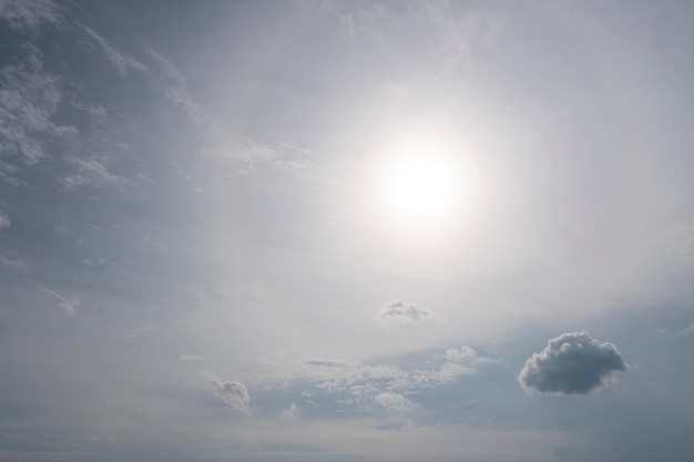 Free photo tiny cloud and sun in the sky