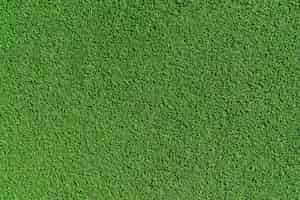 Free photo top view artificial grass soccer field  background texture