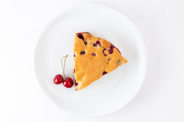 Free photo top view cherry cake slice inside white plate on the white background cake biscuit sweet dough bake