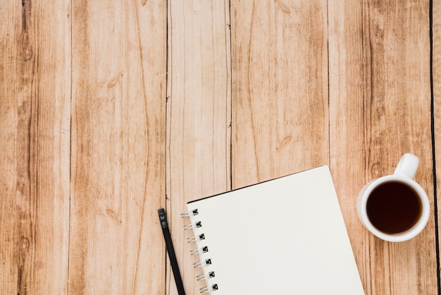 Top view coffee cup with notebook