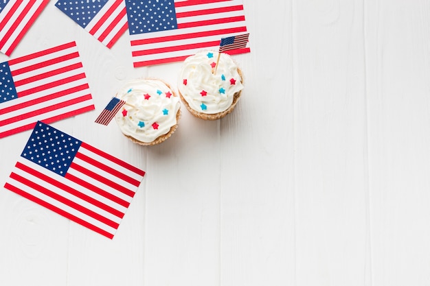 Free photo top view of cupcakes with copy space and american flags