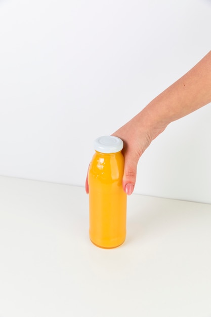 Top view fresh orange juice bottle