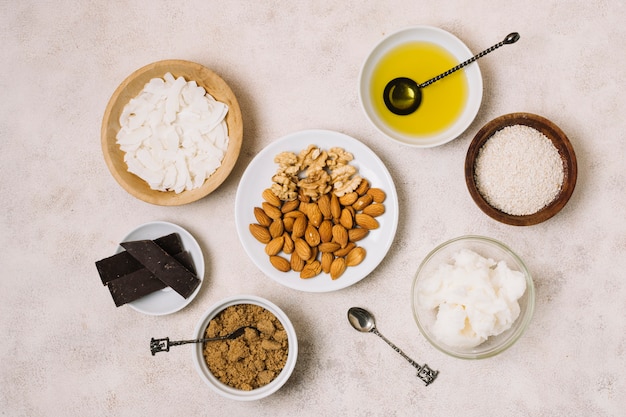 Free photo top view nutritious snacks with coconut and olive oil