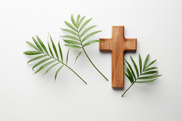 Top view wooden cross and leaves