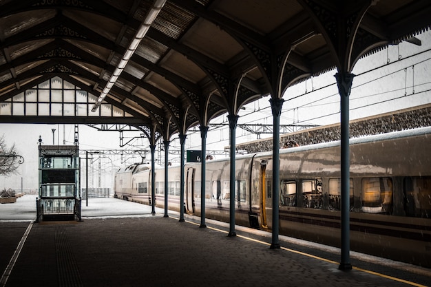 Free photo train in a railway station covered with snow in winter