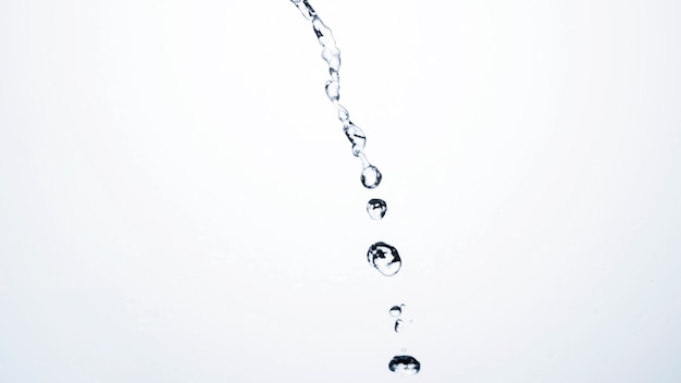 Free photo transparent liquid drops on light background