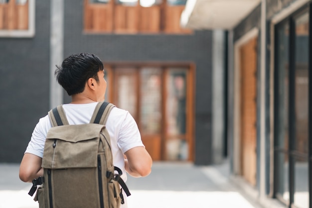 Free photo traveler asian man traveling and walking in beijing, china