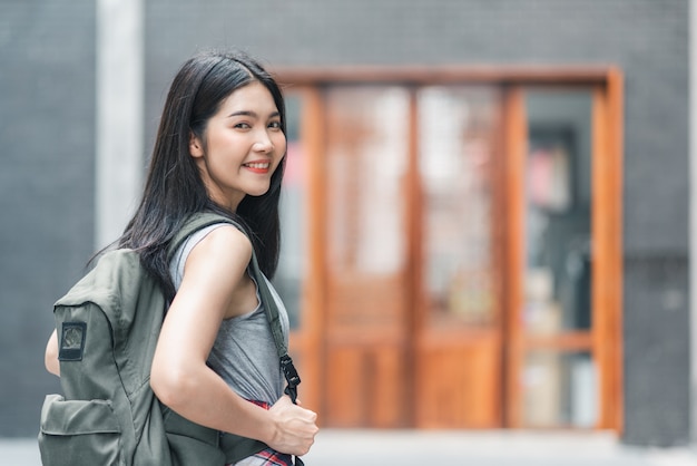 Free photo traveler asian woman traveling and walking in beijing, china