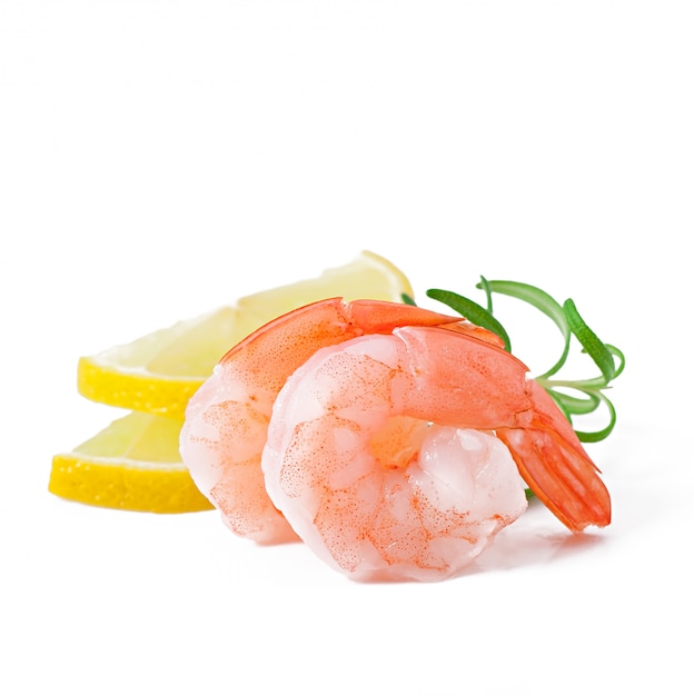 Free photo two tail of shrimp with fresh lemon and rosemary on the white