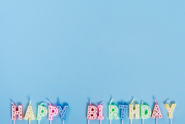 Free photo unlit birthday candles with letters