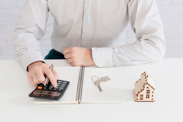 Unrecognizable realtor counting in office