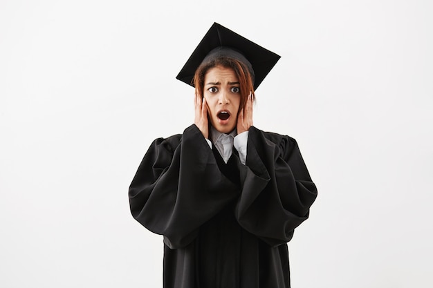 Free photo upset surprised african female graduate.