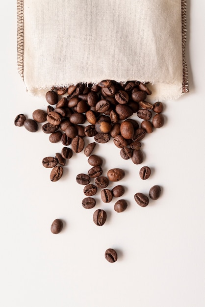 Free photo upside down coffee beans in a bag