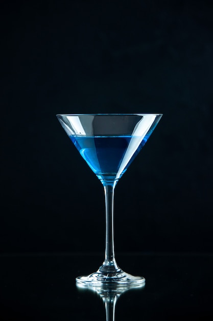 Free Photo vertical view of blue water in a glass goblet on dark background