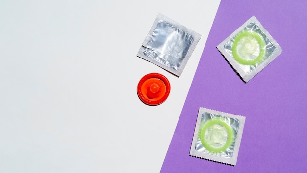 Free photo above view arrangement with red and green condoms