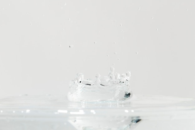 Free photo water splash on top of the glass background