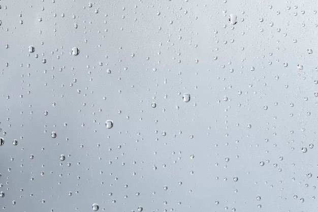 Free photo water texture background, rainy window on cloudy day