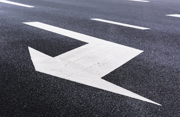 Free photo white arrow on the road