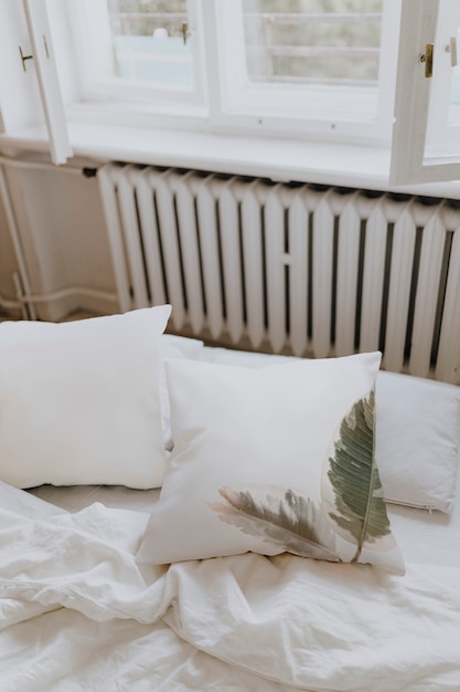 Free Photo white bedding in a bedroom