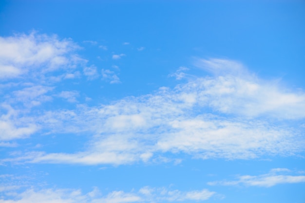 Free photo white clouds with blue sky background